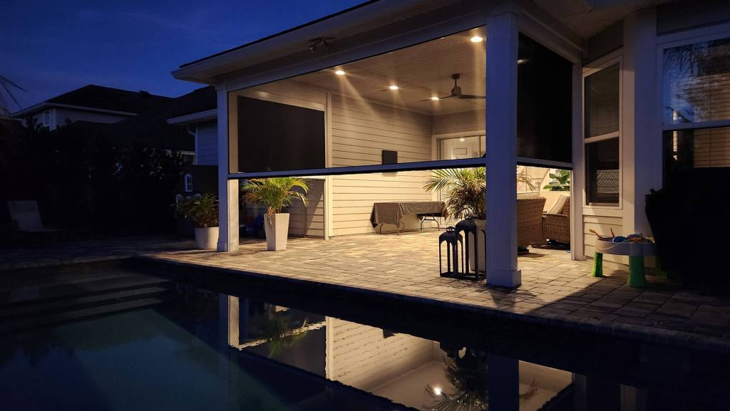 Custom retractable shade at a home by the pool.