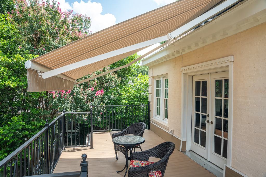 Residential awning providing shade on patio.
